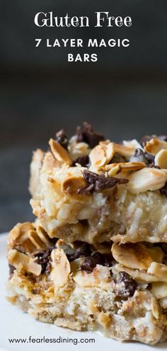 three bars stacked on top of each other with chocolate chips and almonds