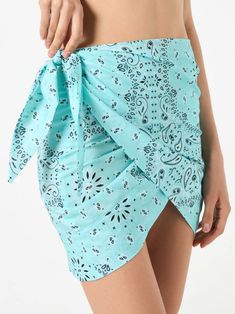 Woman cotton mini skirt pareoWater green bandanna all over printMid lenghtFront knotComposition: 100% Cotton Fitted Printed Mini Skirt For Summer, Casual Summer Mini Wrap Skirt, Casual Mini Wrap Skirt For Summer, Casual Mini Length Wrap Skirt For Summer, Summer Cotton Mini Wrap Skirt, Printed Fitted Beach Skirt, Beach Fitted Printed Skirt, Fitted Printed Beach Skirt, Printed Green Skirt For Vacation