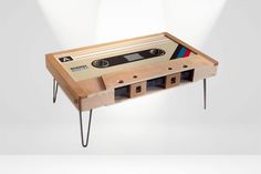 an old school cassette table with hair pins on the legs and a tape recorder attached to it