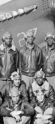 an old black and white photo of men in pilot's gear