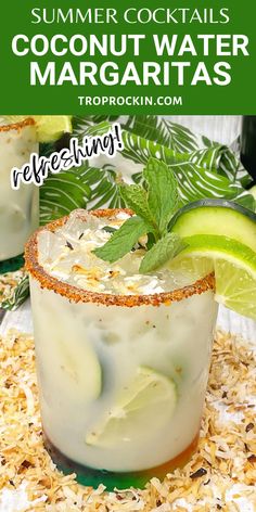 two margaritas with lime and mint garnish on the rim, surrounded by shredded coconut