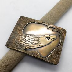 This buckle was inspired by a carved ships figurehead in the Norfolk Virginia maritime museum.  This is a bronze cast of my hand fabricated original.this buckle measures approximately 2x3 inches and fits on an inch and a half wide belt. Ships Figurehead, Ship Figurehead, Norfolk Virginia, Brass Belt Buckles, Maritime Museum, Skull Earrings, Suspender Belt, Vintage Country, Wide Belt