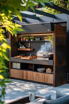 an outdoor kitchen is built into the side of a building with lots of storage space