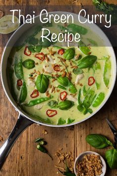 thai green curry recipe in a pan with basil leaves and other ingredients on the side