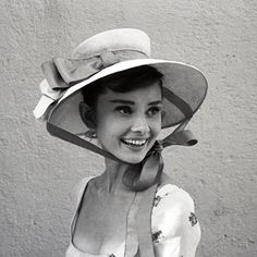 black and white photograph of a woman wearing a hat