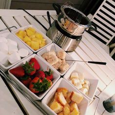 a table topped with bowls filled with different types of food