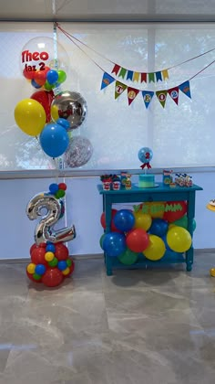 balloons and streamers are on display in the children's birthday party room,