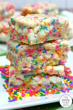 sprinkle covered rice krispy treats stacked on top of each other