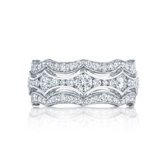 a white gold wedding band with three rows of diamonds on the top and bottom, set in