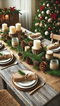 a table set for christmas with pine cones, candles and napkins on the plates