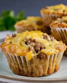 three cheeseburger muffins on a white plate