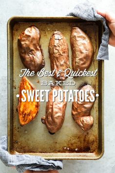 the best and quickest baked sweet potatoes recipe on a baking sheet in someone's hand