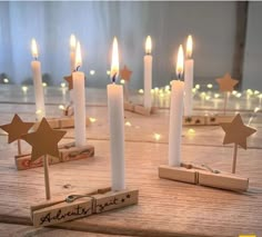 several candles with wooden stars on them