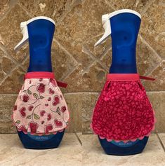 two blue and red vases with hearts on them