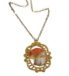 "Sweet woodland mushroom pendant. Image of a red mushroom with white dots is set in a vintage style gold plated pewter setting. Sealed in resin for a glass like appearance. Lead and nickel free gold plated chain. 17 5/8\" end to end. Pendant hangs an additional 1.5\"." Antique Gold Agate Jewelry, Vintage Red Resin Jewelry, Vintage Gold Agate Jewelry, Bohemian Cameo Necklace For Gift, Bohemian Gold Resin Necklace, Red Cameo Necklace For Gift, Vintage Gold Resin Jewelry, Red Cameo Jewelry Gift, Vintage Amber Resin Jewelry