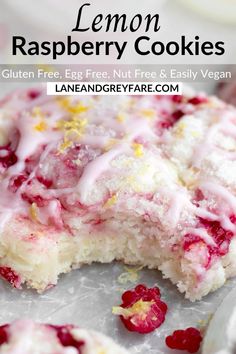 lemon raspberry cookies on a baking sheet with the rest of the cake in the background