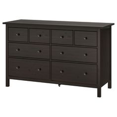 a dark colored dresser with six drawers