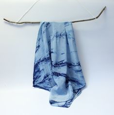 The small silk scarf made of soft, light Crepe de Chine is hand-dyed in Kumo Shibori design with indigo. Crepe de Chine has a smooth surface with fine highlights, which makes the cloth look very noble. Wear it as a scarf or as a bandana in your hair or around your wrist. 100% Crepe de Chine Silk approx. 55 cm x 55 cm hand-dyed with indigo in Kumo Shibori design rolled hem Blue Bohemian Scarf With Natural Dye, Bohemian Blue Scarf With Natural Dye, Blue Bohemian Hand Dyed Silk Scarf, Blue Bohemian Hand-dyed Silk Scarf, Blue Hand Dyed Silk Scarf For Summer, Hand Dyed Blue Silk Scarf For Summer, Summer Hand Dyed Blue Silk Scarf, Blue Hand-dyed Silk Scarf For Summer, Fine Highlights