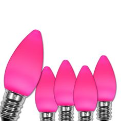 pink light bulbs are lined up in a row