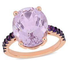 This bold and contemporary amethyst and rose de France cocktail ring is crafted in lustrous rose plated sterling silver and features an oval-cut 7 1/2 carat rose de France as its centerpiece with 12 round-cut amethyst stones studding the top portion of its slender band. Add a touch of color, elegance and sophistication to any ensemble with this breathtaking gemstone ring. Amethyst Set, Amethyst Ring Engagement, 1 Rose, Gemstone Engagement, Pink Amethyst, Black Rhodium, Gemstone Engagement Rings, Amethyst Stone, Amethyst Gemstone