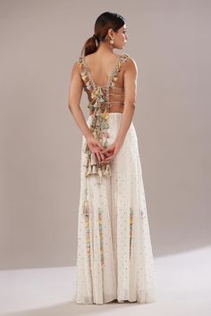 Off white georgette backless blouse with floral, metallic embroidery and back multi tassel tie-ups. Comes with Mukaish georgette sharara. - Aza Fashions Sharara For Women, Georgette Sharara, Payal Singhal, Metallic Embroidery, Backless Blouse, Dyeing Process, Embroidered Blouse, Aza Fashion, Fashion Set