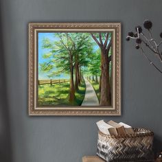 a painting hanging on the wall next to a basket