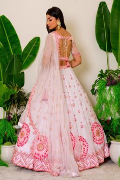 Icy pink lehenga with beads and sequin embroidery. Comes with embroidered blouse and dupatta.
Component: 3
Pattern: Embroidery
Type Of Work: Sequin and Beads
Neckline: Leaf
Sleeve Type: Half
Fabric: Organza
Color: Pink
Other Details: 
Cutwork detail on the hems
Embroidered dupatta with cutwork border
Cutout at the back with tie up
Closure: Back hook
Occasion: Wedding - Aza Fashions Fitted Pink Embroidered Fabric For Navratri, Pink Embroidered Fabric For Designer Festival Wear, Pink Embroidered Fabric For Designer Wear And Festivals, Pink Embroidered Fabric For Designer Festive Wear, Pink Embroidered Fabric For Designer Festivals, Pink Choli With Resham Embroidery In Traditional Drape, Pink Anarkali Embroidered Fabric For Festivals, Anarkali Pink Embroidered Choli, Pink Choli With Resham Embroidery And Traditional Drape