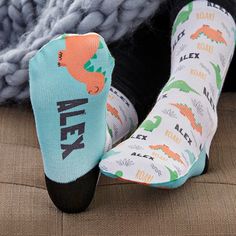 Personalized with any name Kid, unisex crew sockFits kids' shoe size 11-4Cuff measures .75"Overall sock measures 10.75"L x 3"WPolyester/SpandexHeel of sock is black Machine washImported Give a totally unique pair of socks with our Dinosaur Pattern Personalized Boy's Kids Socks. Featuring a repeating dinosaur design, this pair of socks is perfect for any kid. Multicolor Socks For Gifts, Comfortable Non-slip Socks For Playtime, Fun Round Toe Socks For Playtime, Fun Non-slip Socks For Playtime, Personalized Socks, Boys Socks, Dinosaur Pattern, Crew Sock, Dinosaur Design