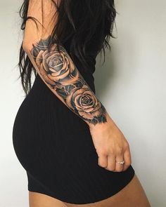 a woman with a rose tattoo on her arm