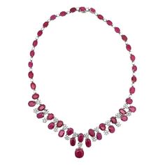 Ruby and Diamond Necklace A necklace with 43 oval-cut rubies separated by round-cut diamonds set in a floral motif Approximately Measures: 16" long Metal type: 18 Karat gold Ruby Diamond Necklace, Ruby And Diamond Necklace, Ruby Necklace, Expensive Jewelry, Ruby Diamond, Drop Necklace, Round Cut Diamond, Floral Motif, Types Of Metal