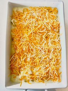 a square casserole dish filled with cheese