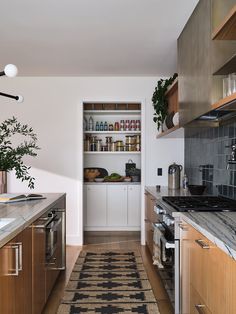 the kitchen is clean and ready for us to use it's shelves are open