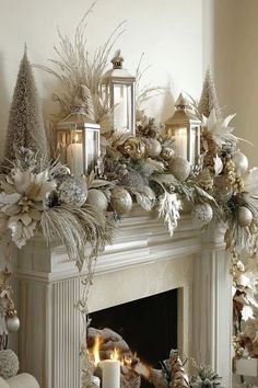 a mantel decorated with silver and white christmas decorations, candles and ornaments on top of it