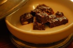 some brownies are sitting in a white bowl