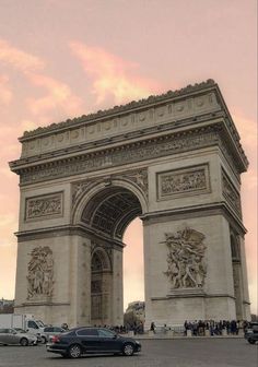 cars are parked in front of the arc de trioe, which is also known as the arch of triumph