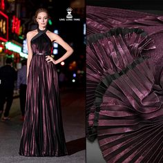 a woman in a long purple dress standing next to an umbrella with black pleating on it