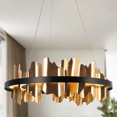 a modern chandelier hanging from the ceiling