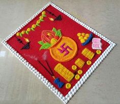 a close up of a red cloth with designs on it