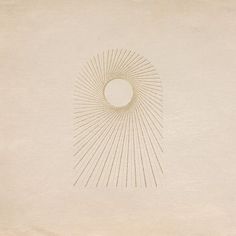 an image of a sunburst in the middle of a white paper with gold lines on it