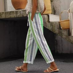 Brighten your wardrobe with our Casual Multicolor Striped Ankle Pants, featuring vibrant stripes and a comfortable fit. Perfect for adding a pop of color to your everyday look. These pants are ideal for casual outings and stylish adventures. Casual Spring Bottoms With Vertical Stripes, Casual Striped Ankle-length Pants, Spring Vacation Pants With Vertical Stripes, Casual Ankle-length Bottoms With Vertical Stripes, Casual Ankle-length Pants With Vertical Stripes, Casual Ankle-length Striped Pants, Casual Striped Pants For The Beach, Green Bottoms With Vertical Stripes For Summer, Striped Beach Pants With Pockets