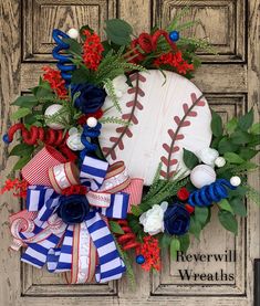 a baseball wreath with red, white and blue flowers