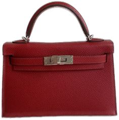 a red leather handbag with a metal handle on the top and bottom flaps