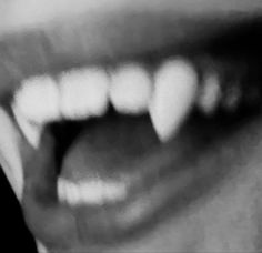 a close up of a person's mouth with teeth missing