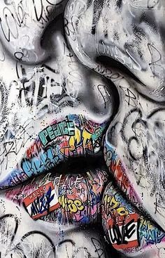 graffiti on the side of a wall with lips and words written all over it in different colors