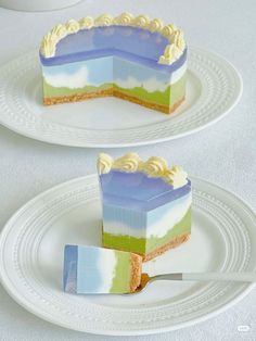 two pieces of cake sitting on top of white plates