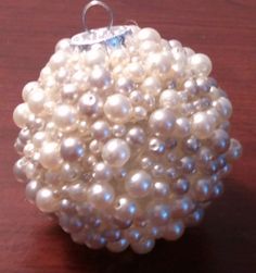 a bunch of pearls sitting on top of a wooden table