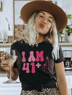 Say hello to 42 with a touch of humor and style! Whether it's for a friend, a mother, a sister, or for yourself, this trendy and sassy t-shirt is the perfect gift to make someone's 42nd birthday extra special. DETAILS * Bella + Canvas Unisex Premium T-Shirt * Soft and lightweight * 100% combed and ring-spun cotton * Heather colors are 52% combed and ring-spun cotton, 48% polyester * Design is printed using DTG technology which uses high-quality water-based inks that are printed directly into the 50th Birthday Tshirts, Birthday Shirt For Women, Middle Finger Funny, 45th Birthday Gifts, 50th Birthday Gifts For Woman, 42nd Birthday, 50th Birthday Shirts, 50th Birthday Funny, 1st Birthday Shirts