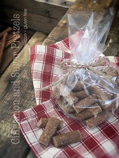 a bag of dog treats sitting on top of a red and white checkered table cloth