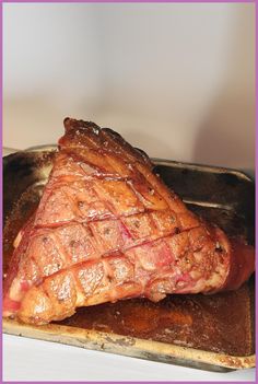 a piece of meat sitting on top of a pan