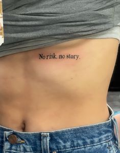 a woman's stomach with the words, not to story tattooed on her side